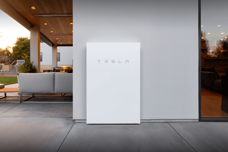 tesla power wall on the side of a house