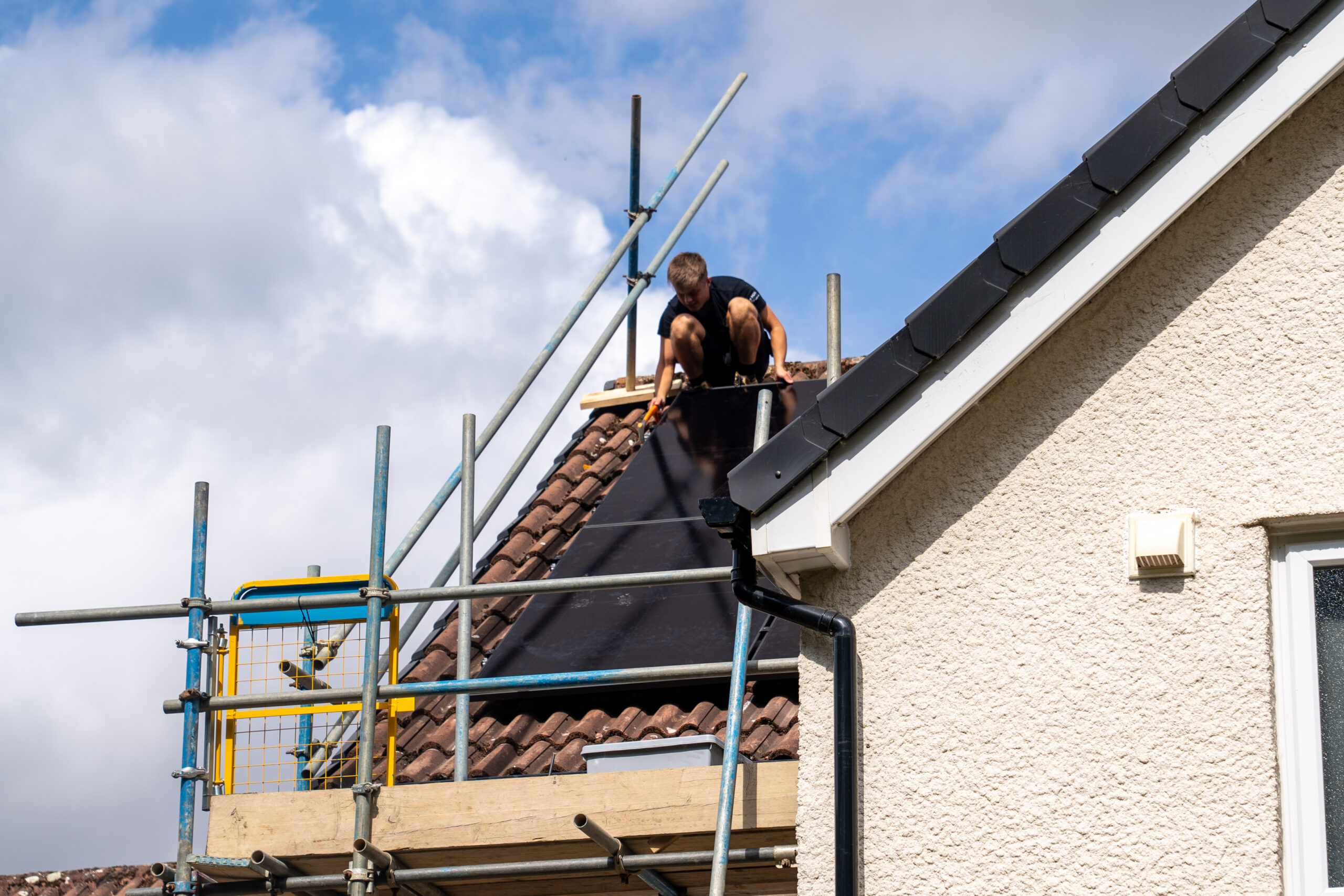 MCS Accredited Installer DMH electrical and renewables working on a Solar PV and battery install